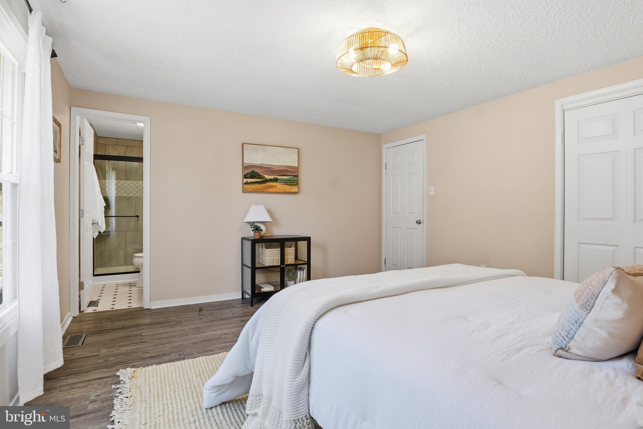 339 Lay Road Delta, PA 17314 - Photo 21 of 60 a bedroom with a bed and a table in it