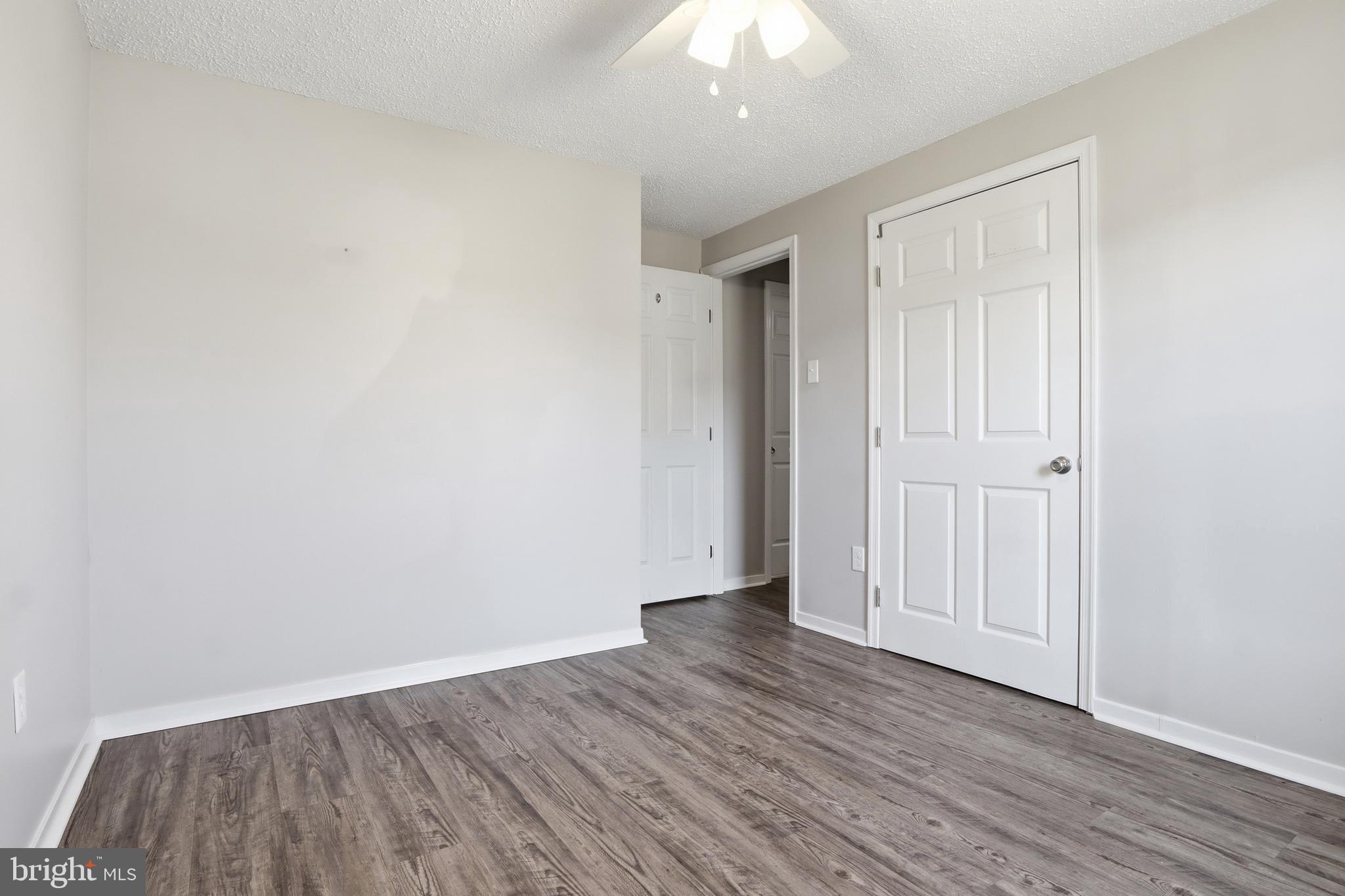 339 Lay Road Delta, PA 17314 - Photo 24 of 60 an empty room with wooden floor and windows