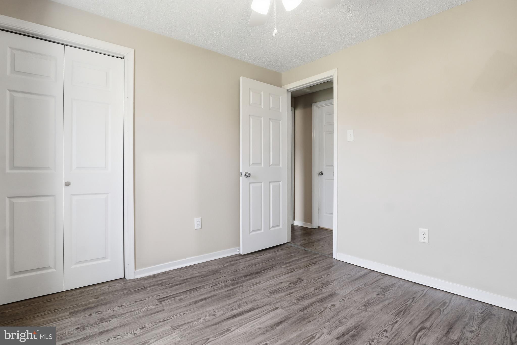 339 Lay Road Delta, PA 17314 - Photo 26 of 60 an empty room with wooden floor and closet area