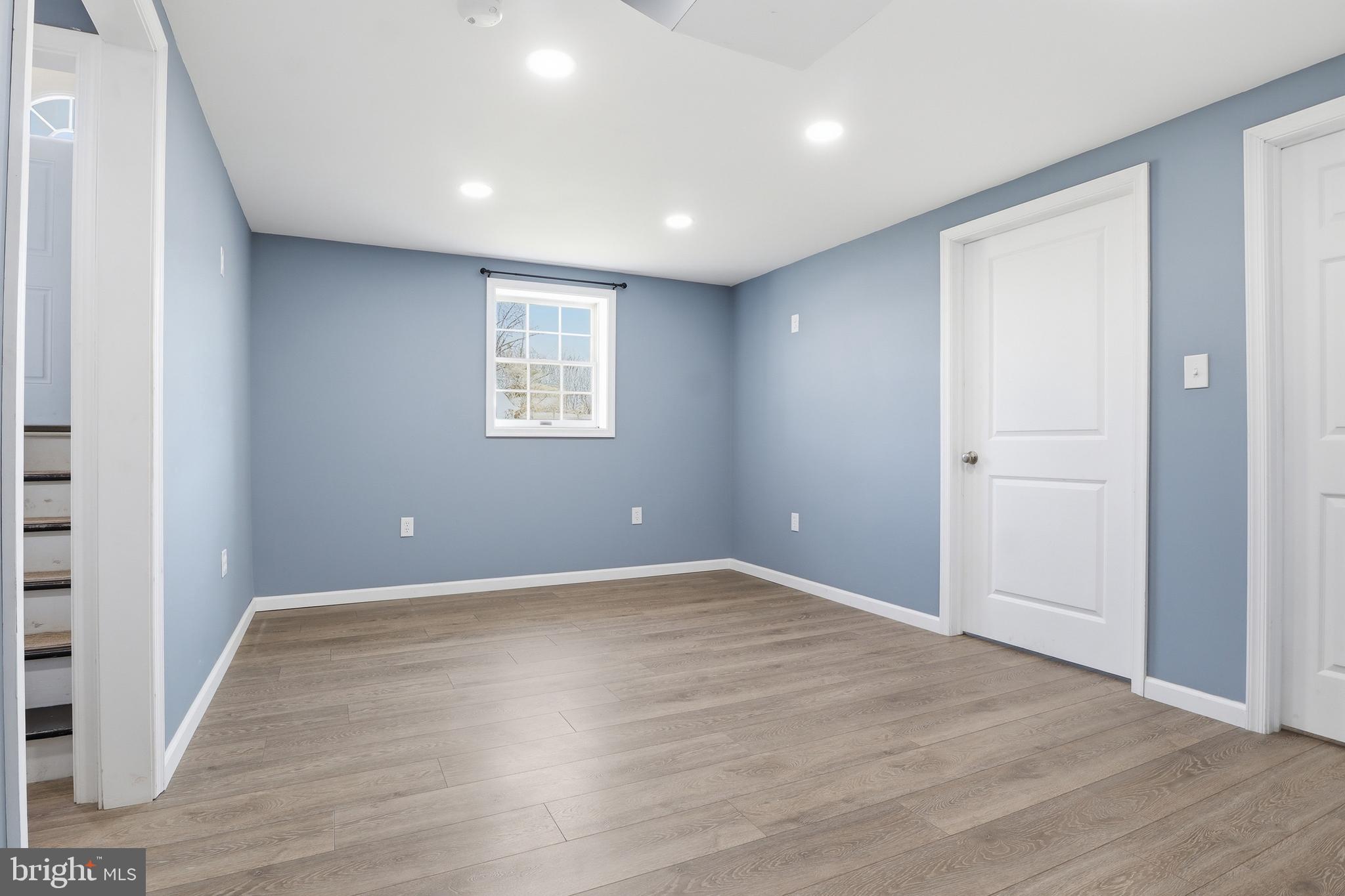 339 Lay Road Delta, PA 17314 - Photo 30 of 60 a view of an empty room with wooden floor and a window