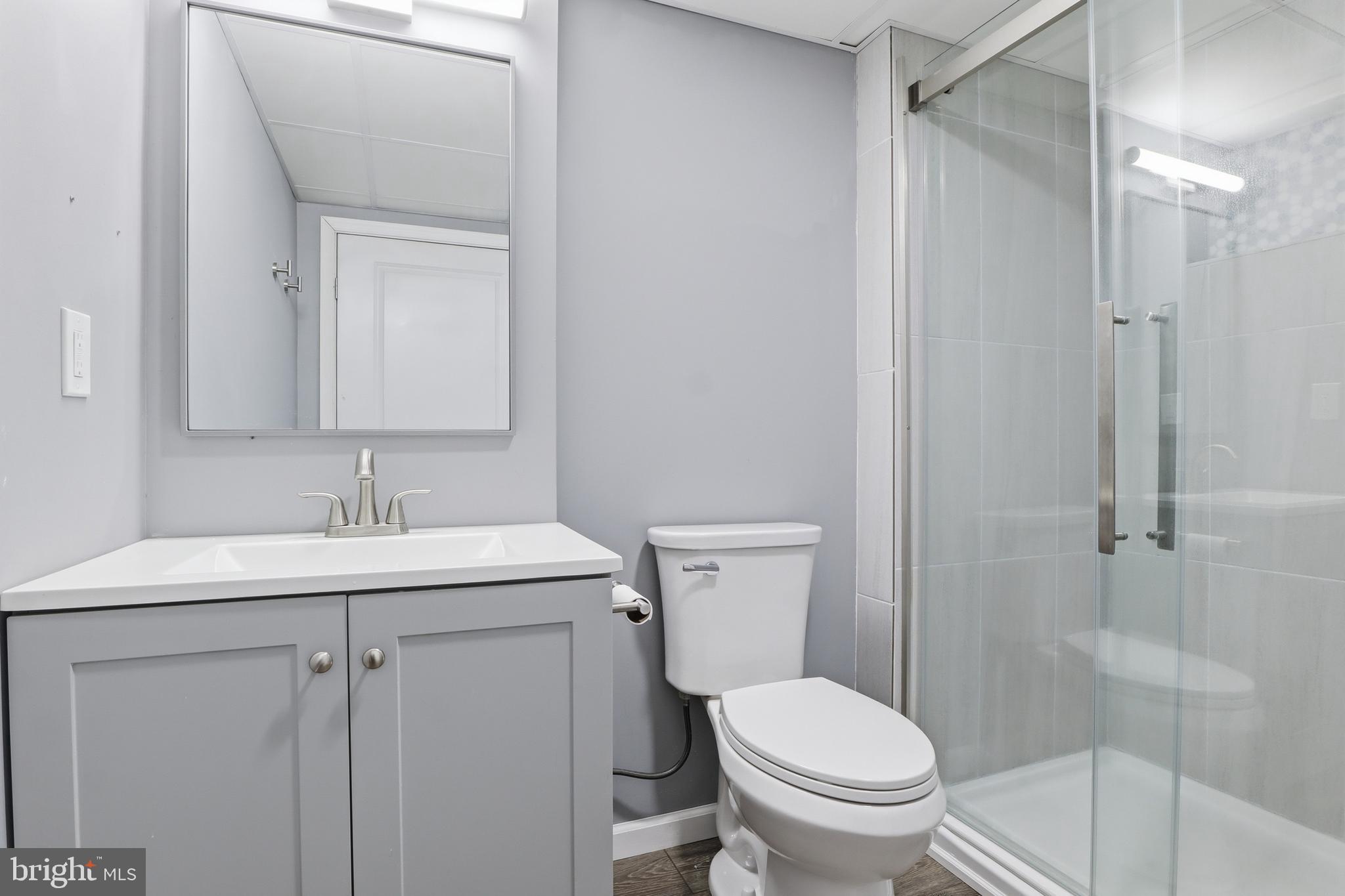 339 Lay Road Delta, PA 17314 - Photo 37 of 60 a bathroom with a granite countertop sink toilet and shower