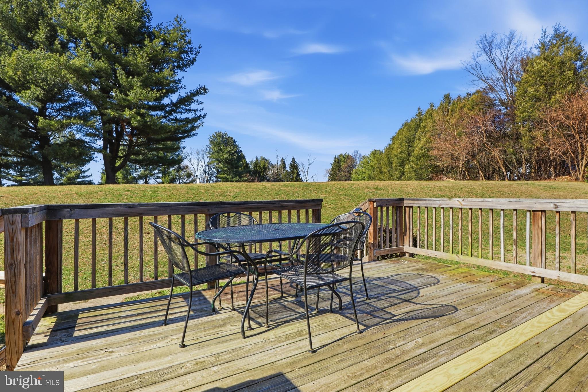 339 Lay Road Delta, PA 17314 - Photo 43 of 60 a view of a roof deck with table and chairs and wooden floor