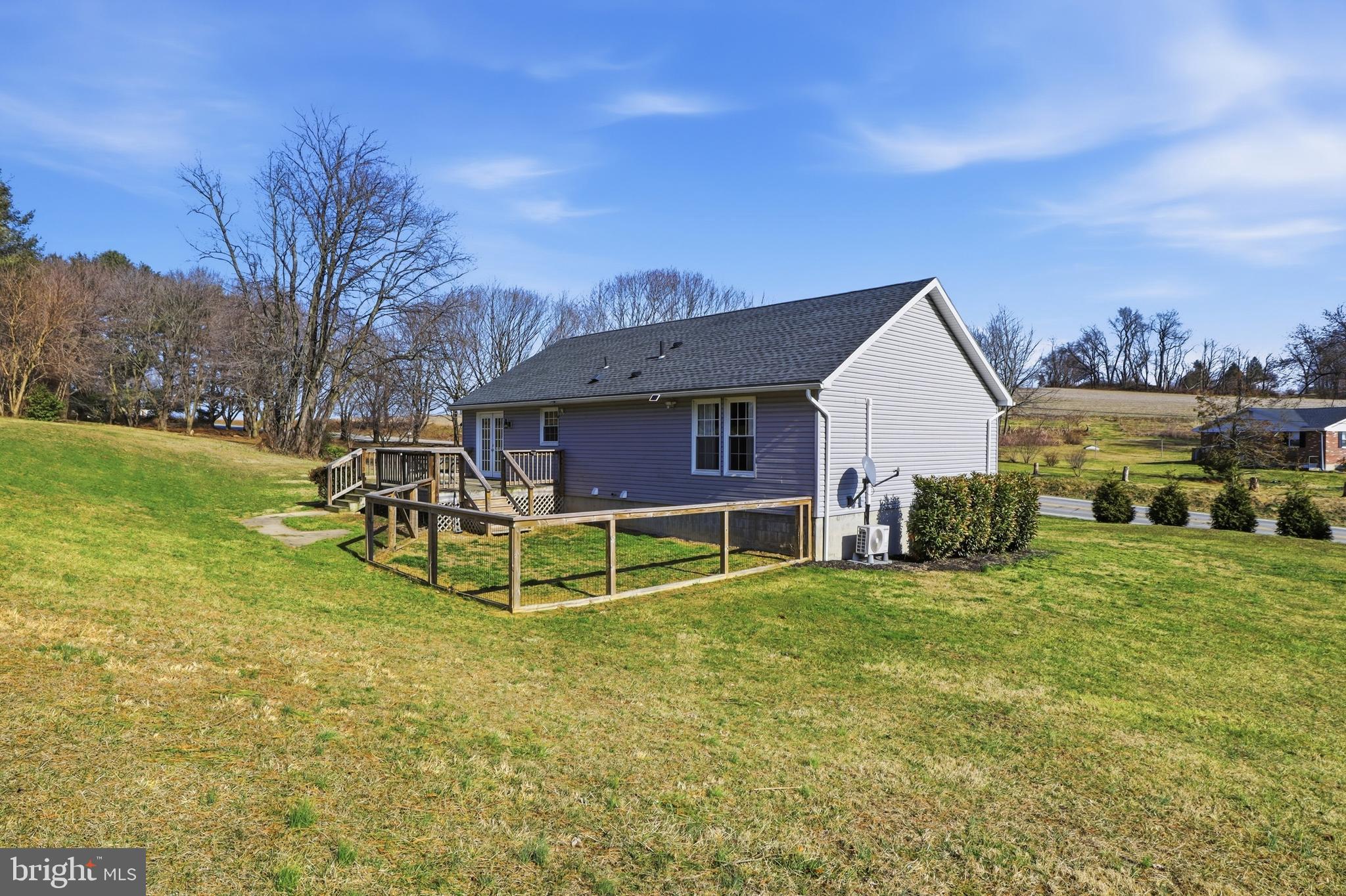 339 Lay Road Delta, PA 17314 - Photo 48 of 60 a view of a house with a big yard and large trees