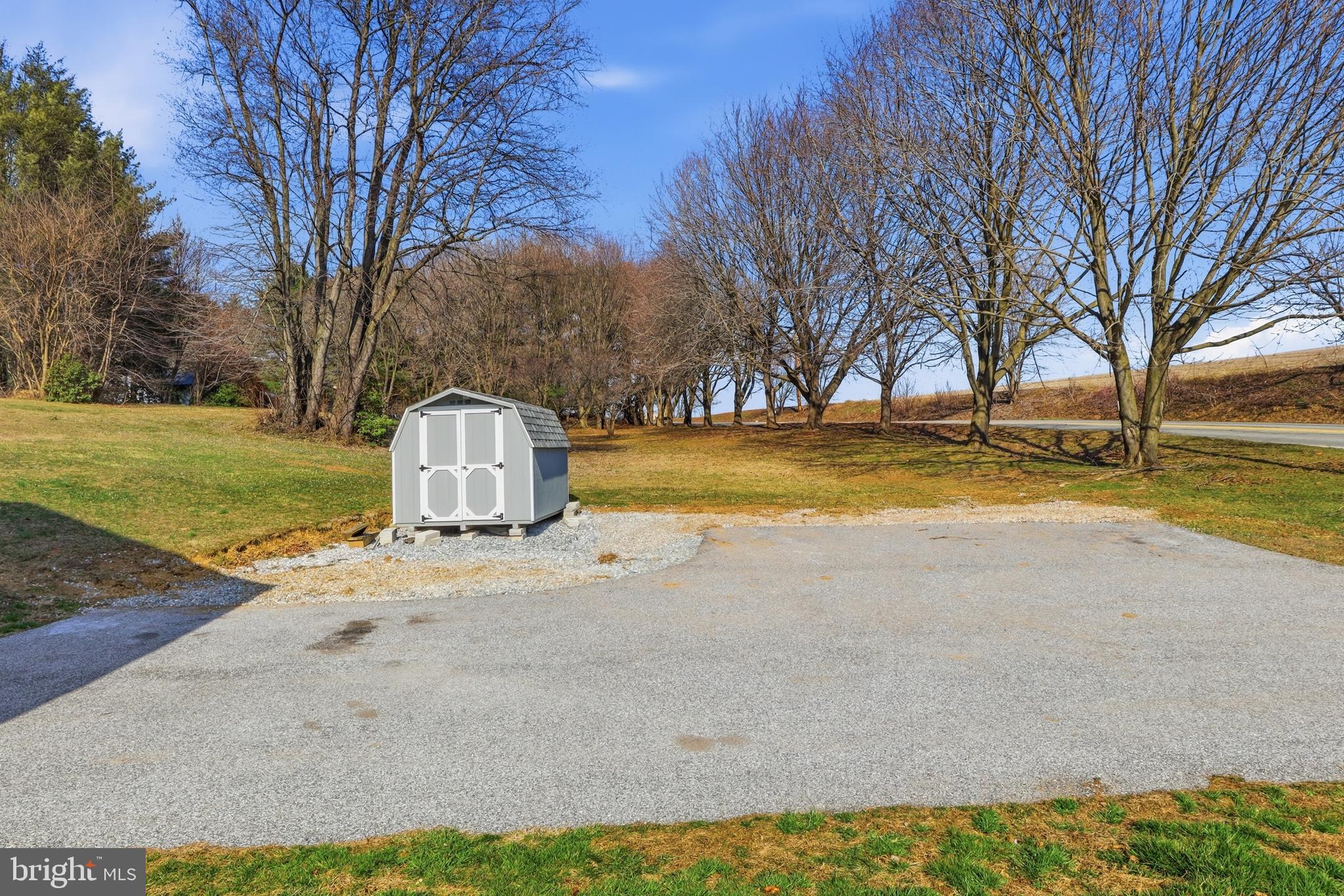 339 Lay Road Delta, PA 17314 - Photo 49 of 60 a view of a swimming pool with an outdoor space and seating area
