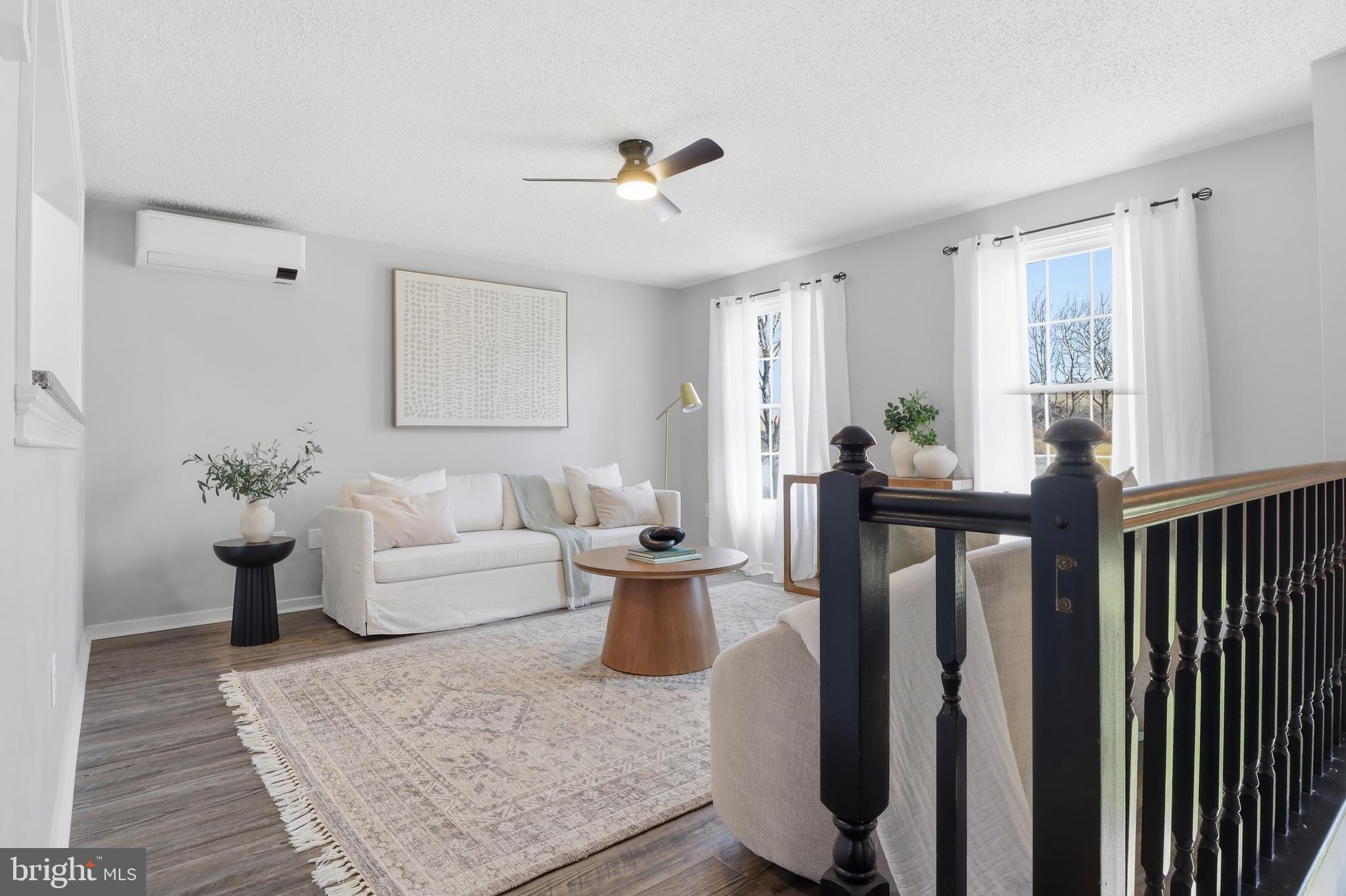 339 Lay Road Delta, PA 17314 - Photo 8 of 60 a living room with furniture a window and a potted plant