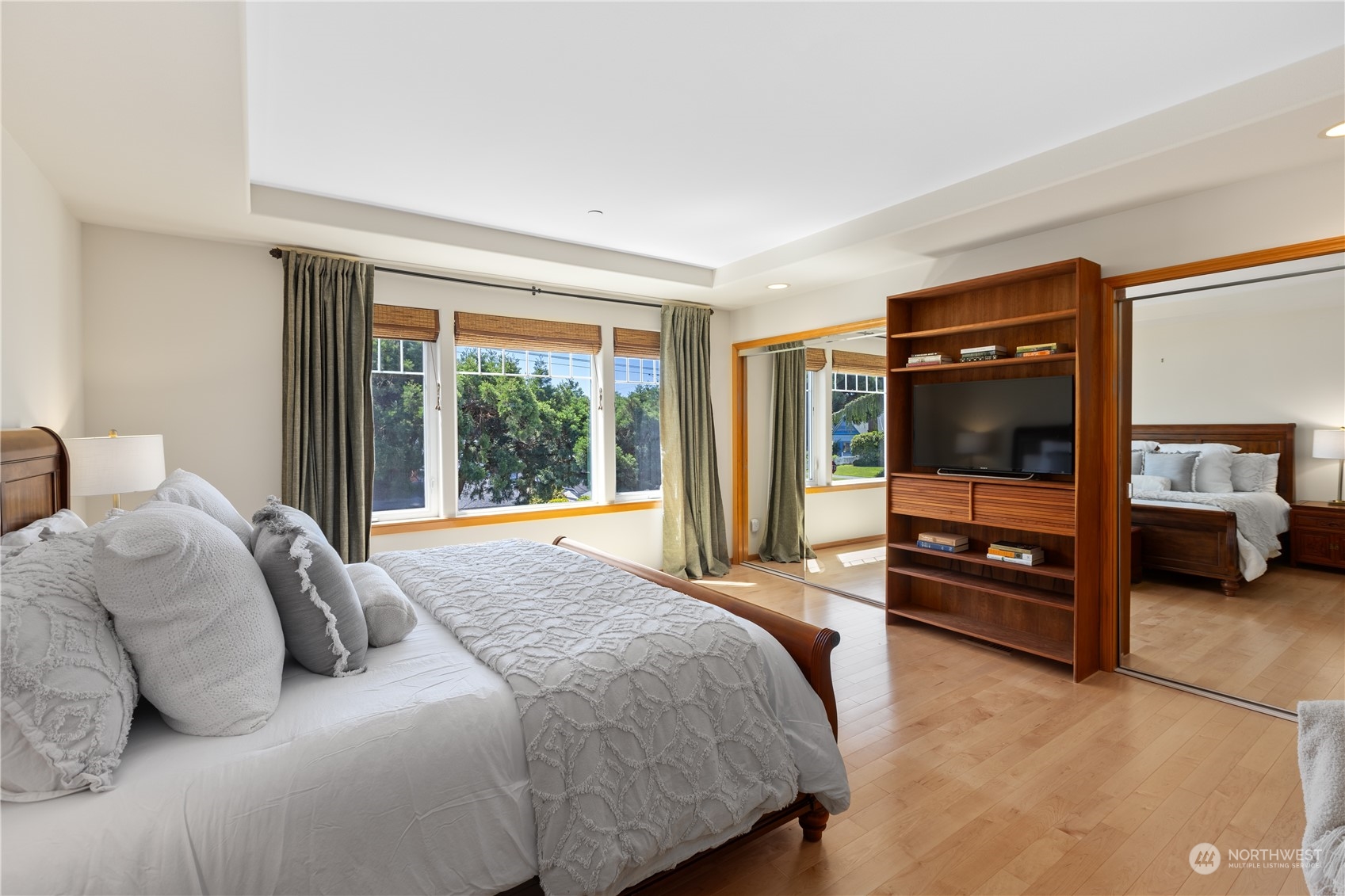 2030 Rucker Avenue, Unit 3 Everett, WA 98201 - Photo 17 of 40 a bedroom with a bed and a television
