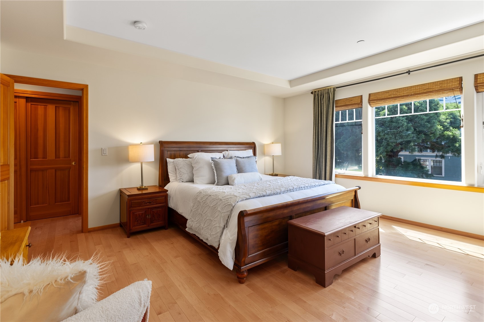 2030 Rucker Avenue, Unit 3 Everett, WA 98201 - Photo 19 of 40 a bedroom with a large bed and a large window