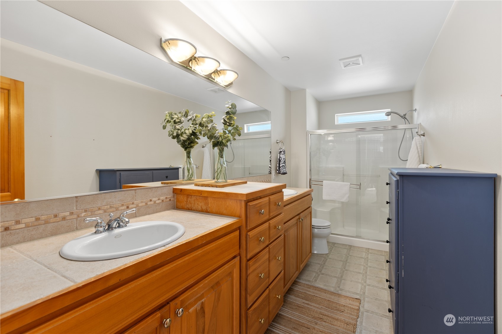 2030 Rucker Avenue, Unit 3 Everett, WA 98201 - Photo 20 of 40 a spacious bathroom with double vanity and a mirror