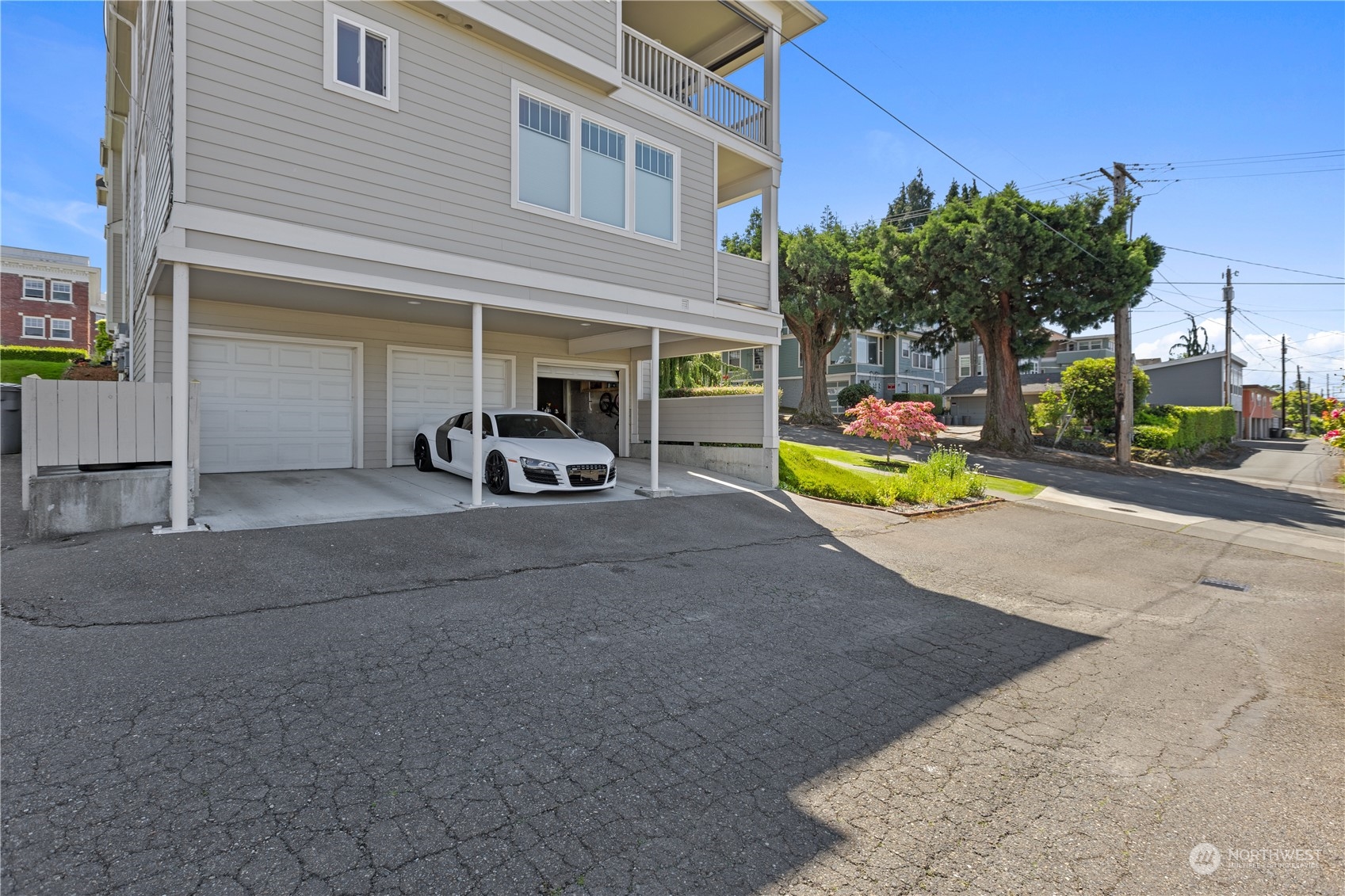 2030 Rucker Avenue, Unit 3 Everett, WA 98201 - Photo 31 of 40 a view of a house with a patio and a yard