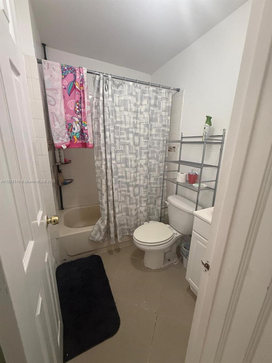 7900 Southwest 21st Terrace Miami, FL 33155 - Photo 11 of 19 a bathroom with a toilet and a shower