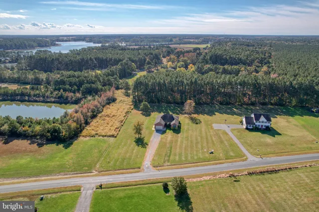 an aerial view of a house with a swimming pool