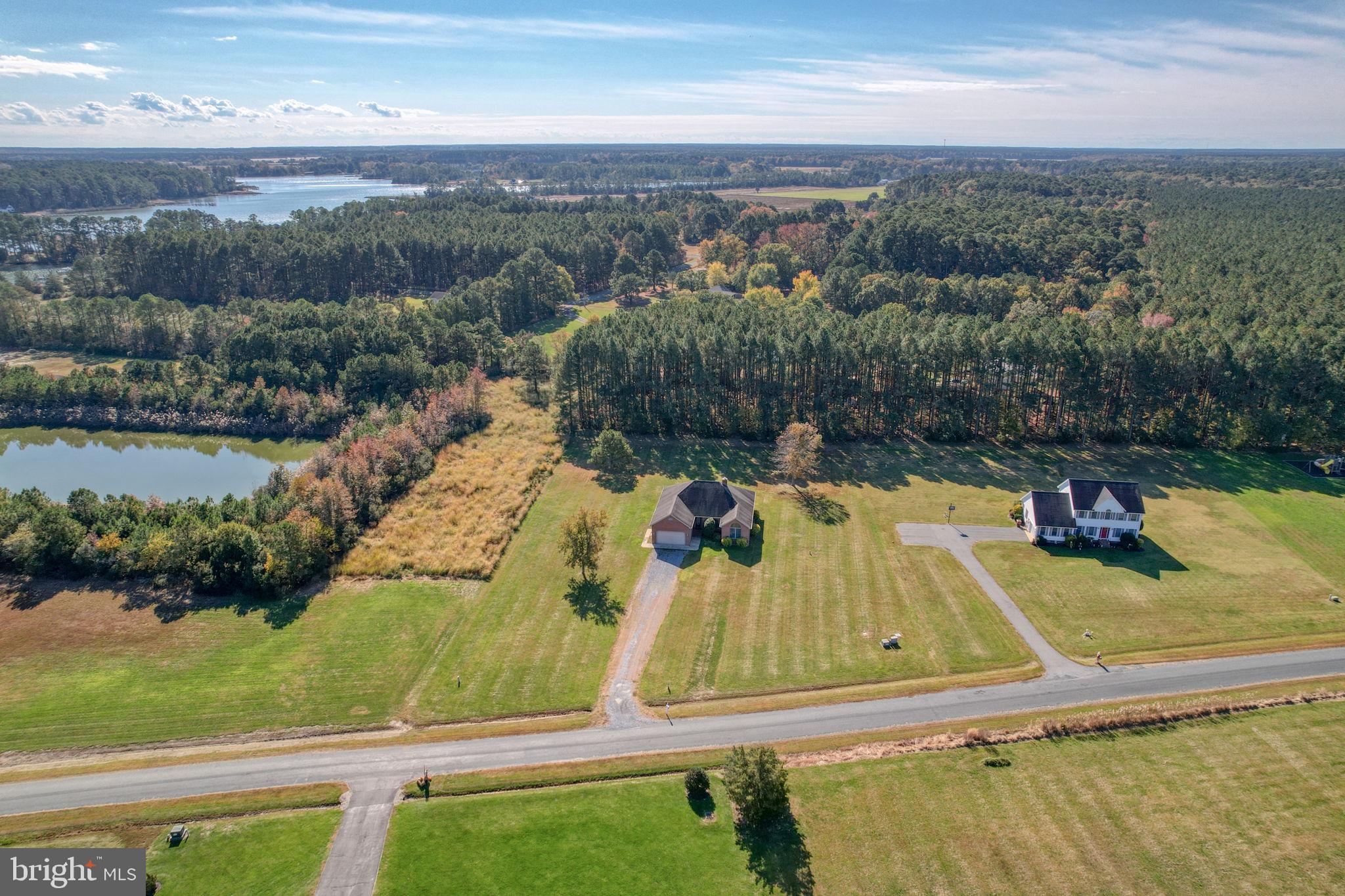 an aerial view of a house with a swimming pool