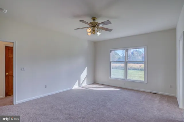 a bathroom with a double vanity sink a toilet and a mirror