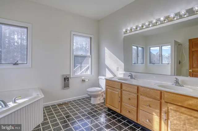 a bathroom with a bathtub and shower