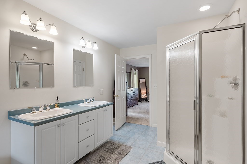 2 Gullane Road Hooksett, NH 03106 - Photo 19 of 27 a spacious bathroom with a double vanity sink mirror and shower