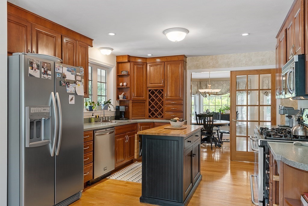 2 Gullane Road Hooksett, NH 03106 - Photo 8 of 27 a kitchen with stainless steel appliances granite countertop a refrigerator a stove and a sink