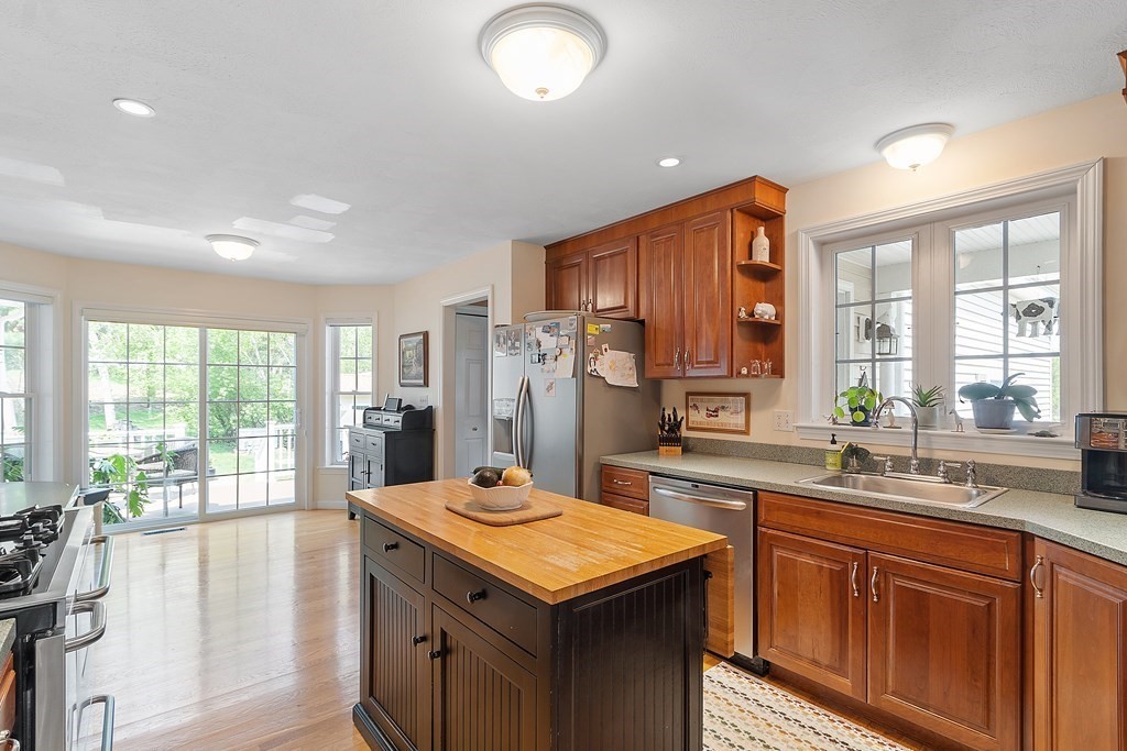 2 Gullane Road Hooksett, NH 03106 - Photo 9 of 27 a kitchen with a sink stove and refrigerator