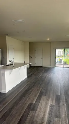a view of a kitchen counter space and wooden floor