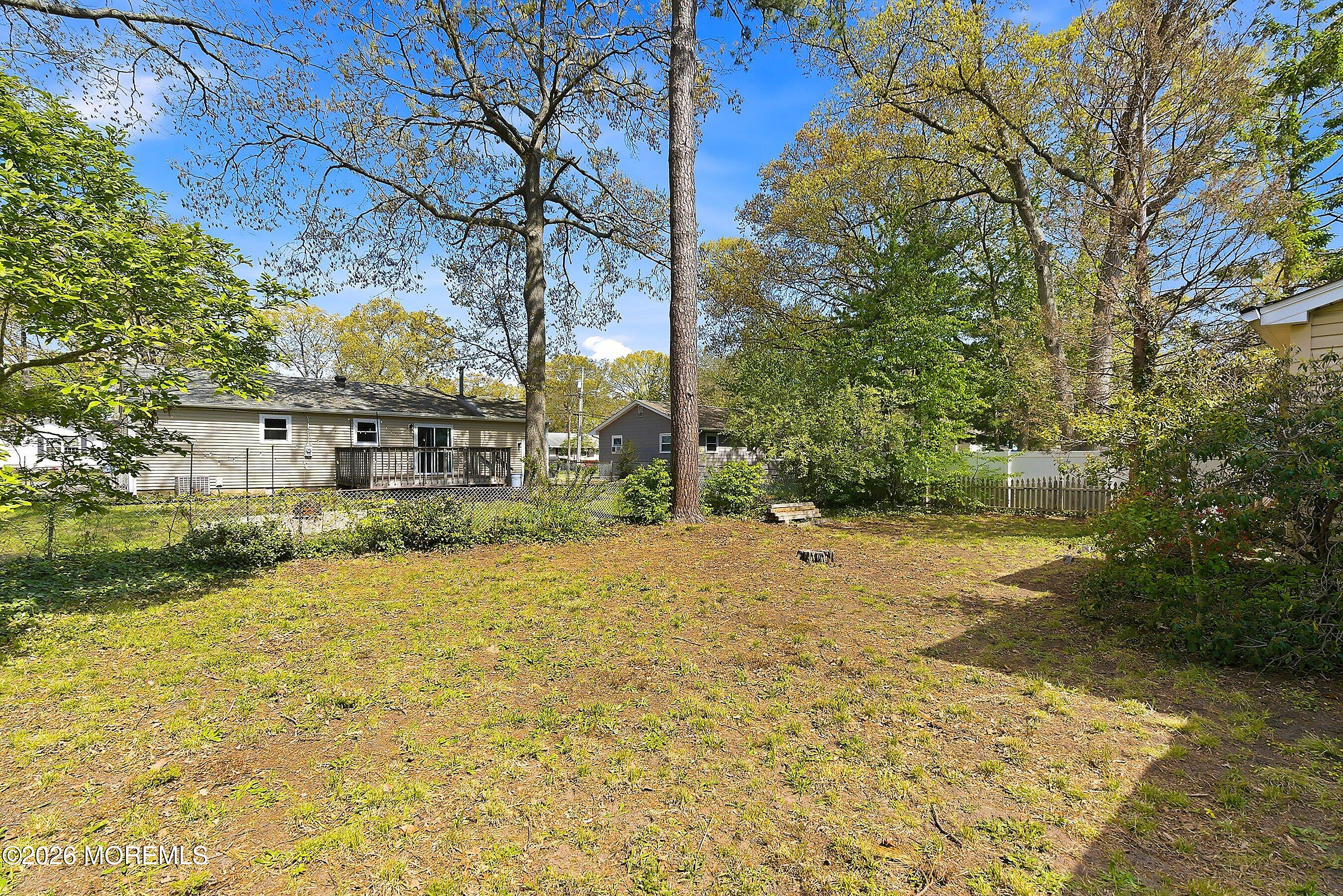 464 Newport Road Forked River, NJ 08731 - Photo 23 of 23 a view of a yard with plants and trees
