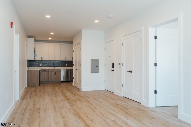 67 Summer Avenue, Unit 202 Newark, NJ 07104 - Photo 3 of 26 a view of kitchen with wooden floor