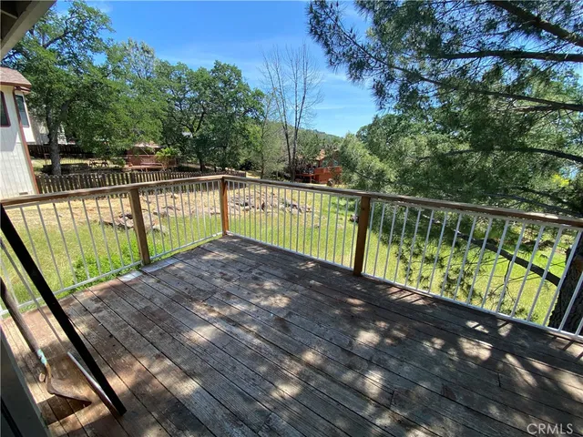 a view of two chairs in the balcony