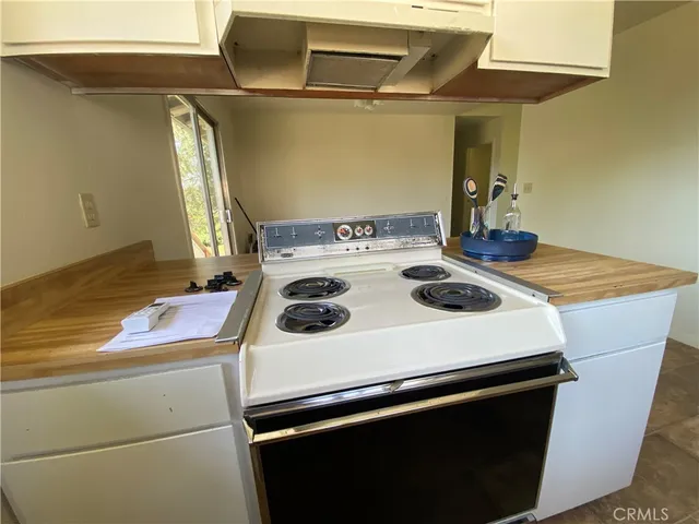 a kitchen that has a sink and a stove