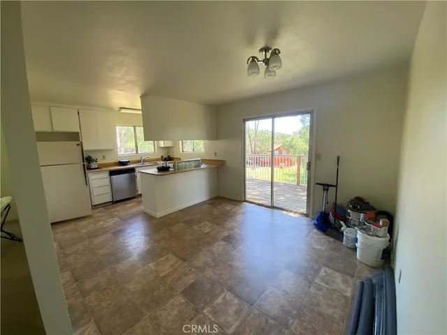 a kitchen with a sink appliances and cabinets