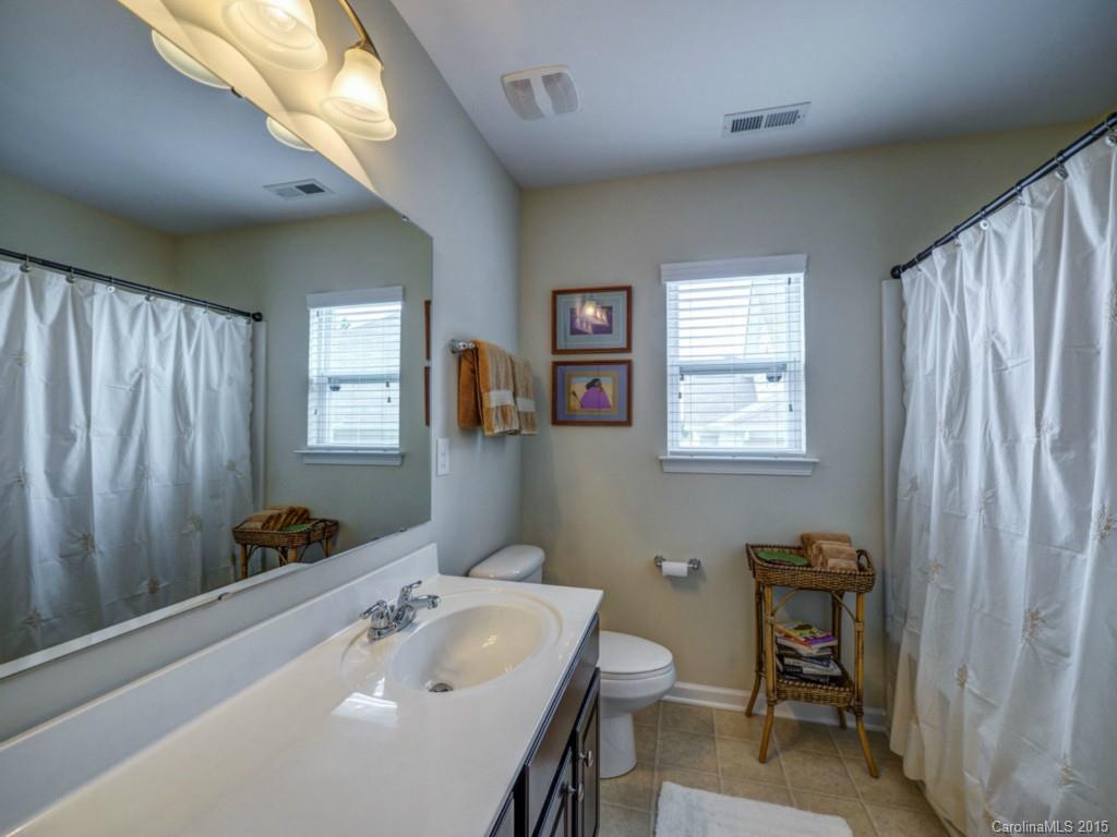 16854 Rudence Court Charlotte, NC 28278 - Photo 13 of 23 a bathroom with a sink and a mirror