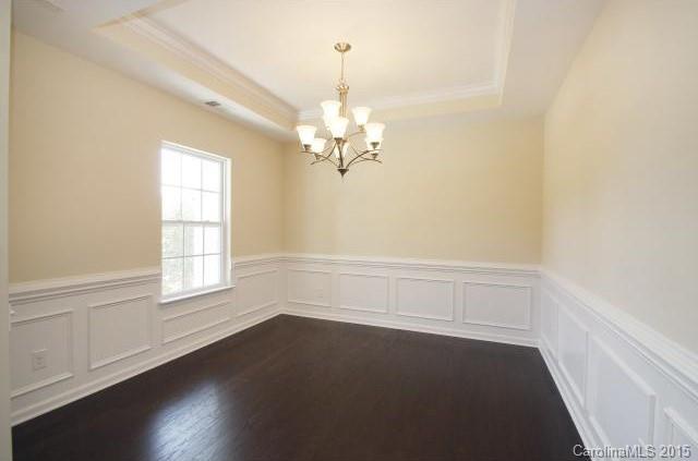 16854 Rudence Court Charlotte, NC 28278 - Photo 14 of 23 an empty room with wooden floor and windows