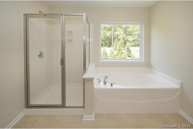 16854 Rudence Court Charlotte, NC 28278 - Photo 16 of 23 a bathroom with a bathtub and shower
