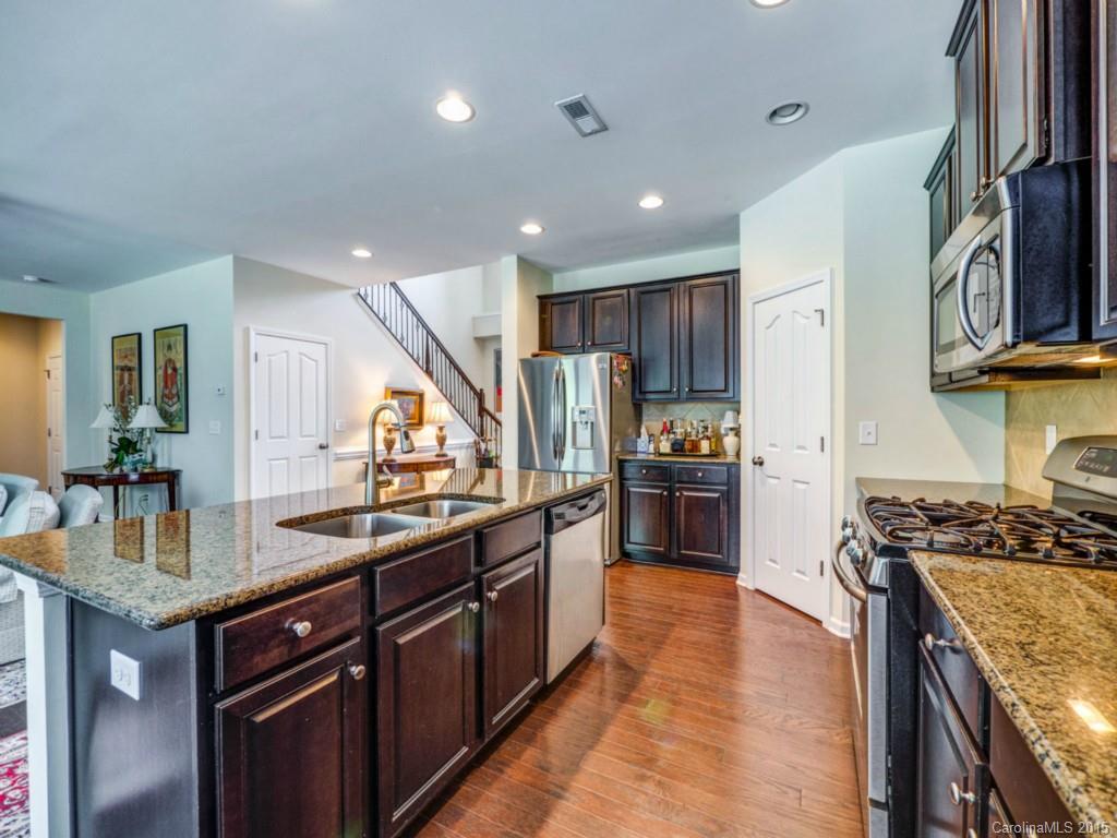 16854 Rudence Court Charlotte, NC 28278 - Photo 3 of 23 a kitchen with stainless steel appliances granite countertop a sink stove and refrigerator