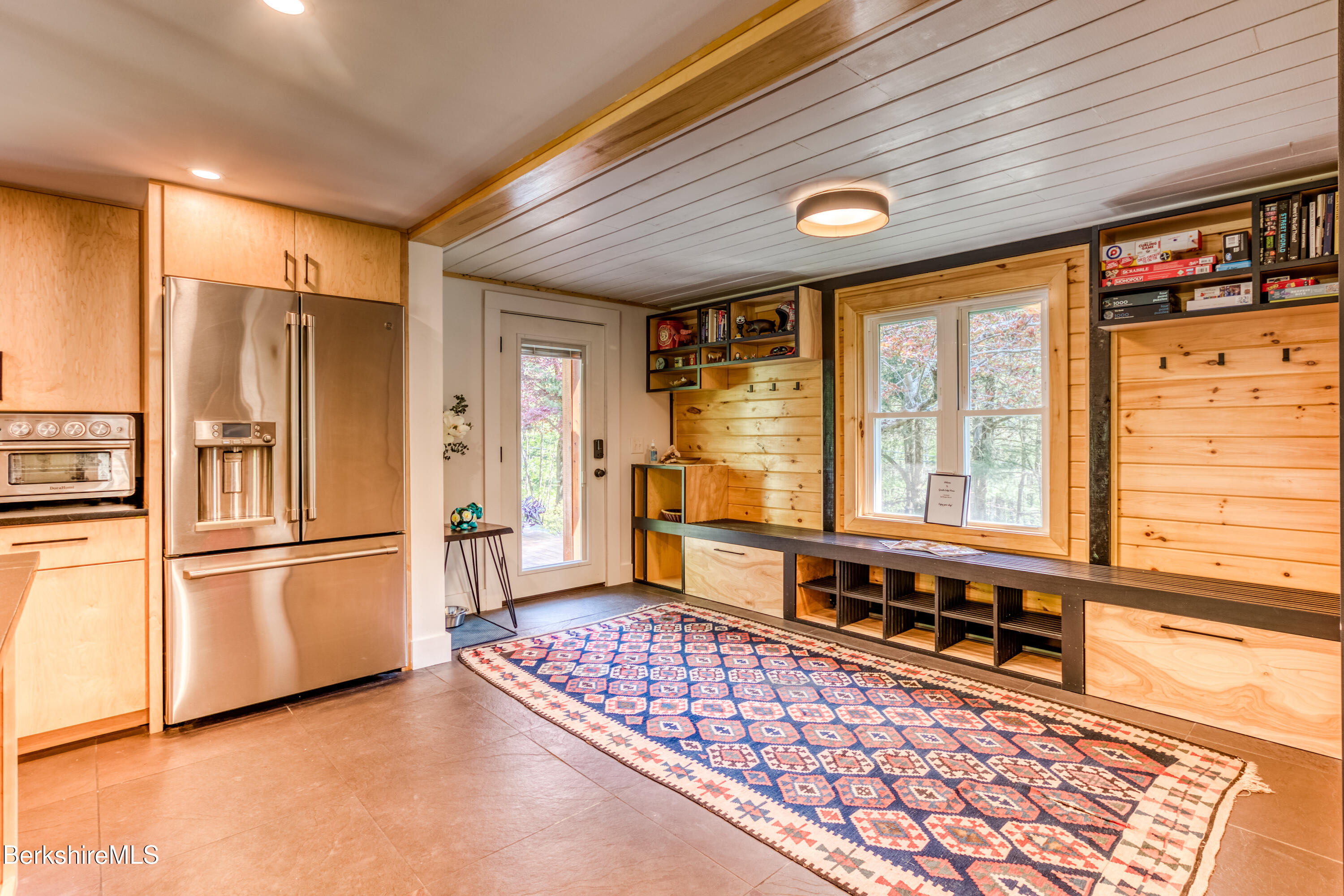 6 Lake Buel Road Great Barrington, MA 01230 - Photo 9 of 38 a kitchen with stainless steel appliances granite countertop a refrigerator and a stove top oven