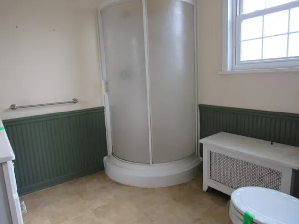 a bathroom with a toilet and a bathtub