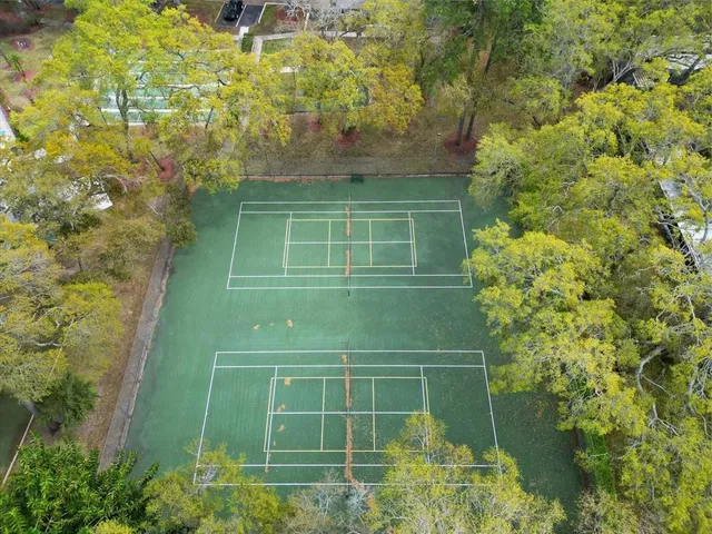 a bathroom with a shower and a sink