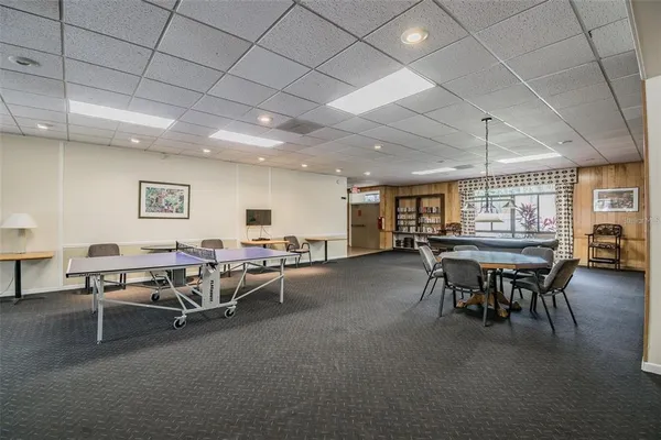 a living room with lots of furniture and a table