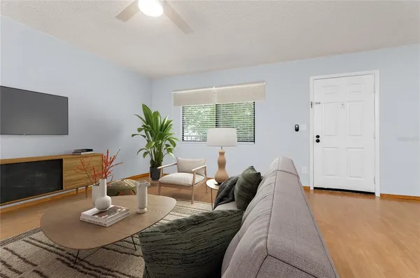 a living room with furniture and a fireplace