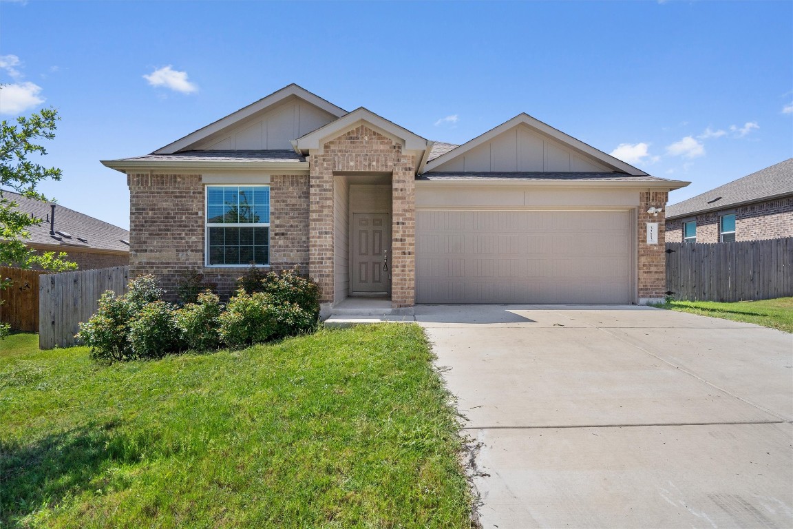 3213 Ancira Place Pflugerville, TX 78660 - Photo 2 of 30 a front view of a house with garden