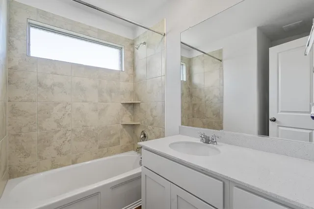 a bathroom with a sink and a bathtub