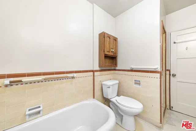 a bathroom with a toilet and a sink