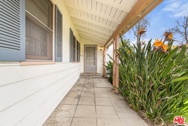 a view of a pathway besides a house