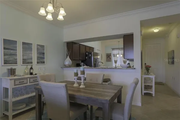 a view of a dining room with furniture and window