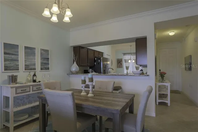 a view of a dining room with furniture and window