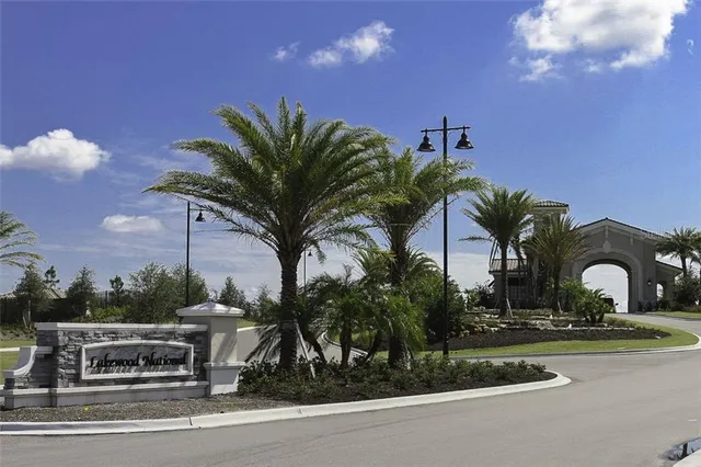 a view of a building with a swimming pool and sitting area
