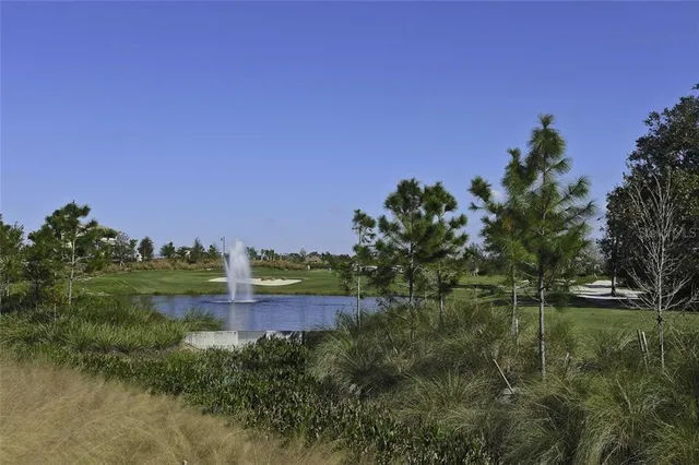 a view of a lake with a building in the background