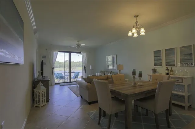 a view of a dining room with furniture and window