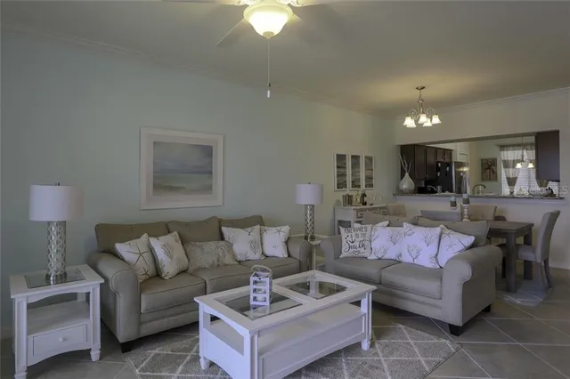 a living room with furniture and a lamp