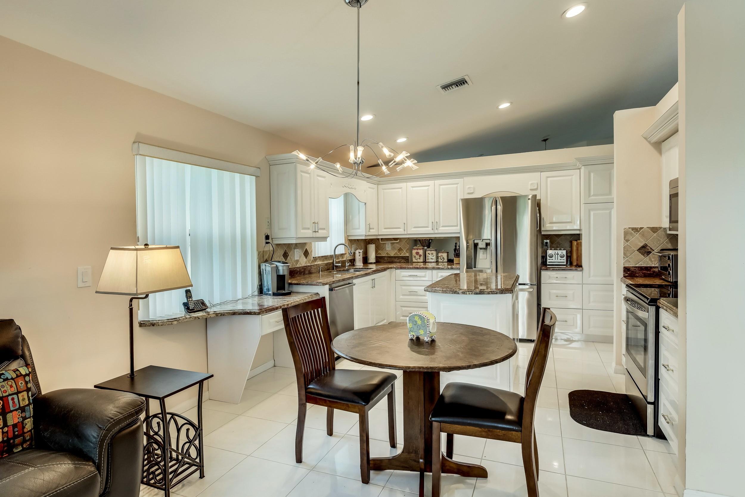 6741 Sun River Road Boynton Beach, FL 33437 - Photo 14 of 57 Kitchen w/newer SS Appliances