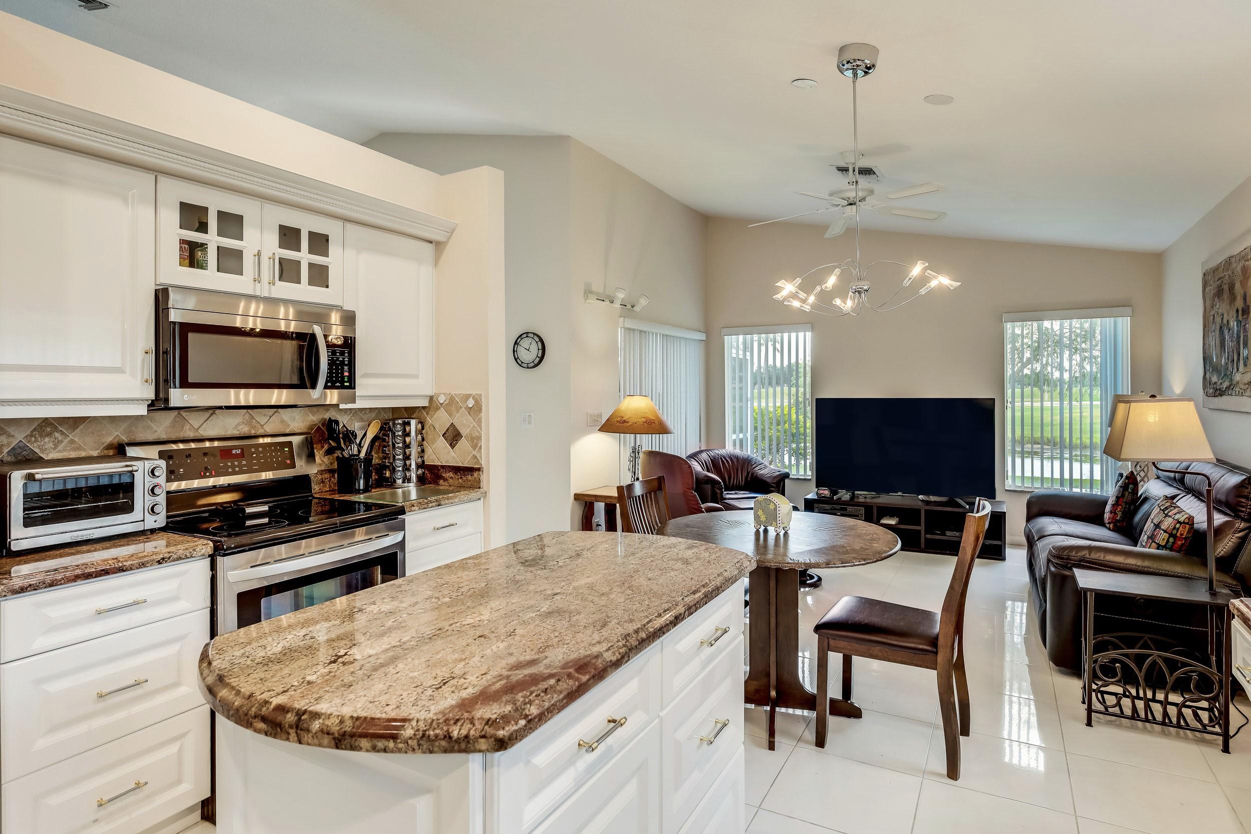 6741 Sun River Road Boynton Beach, FL 33437 - Photo 16 of 57 View of kitchen looking into family room