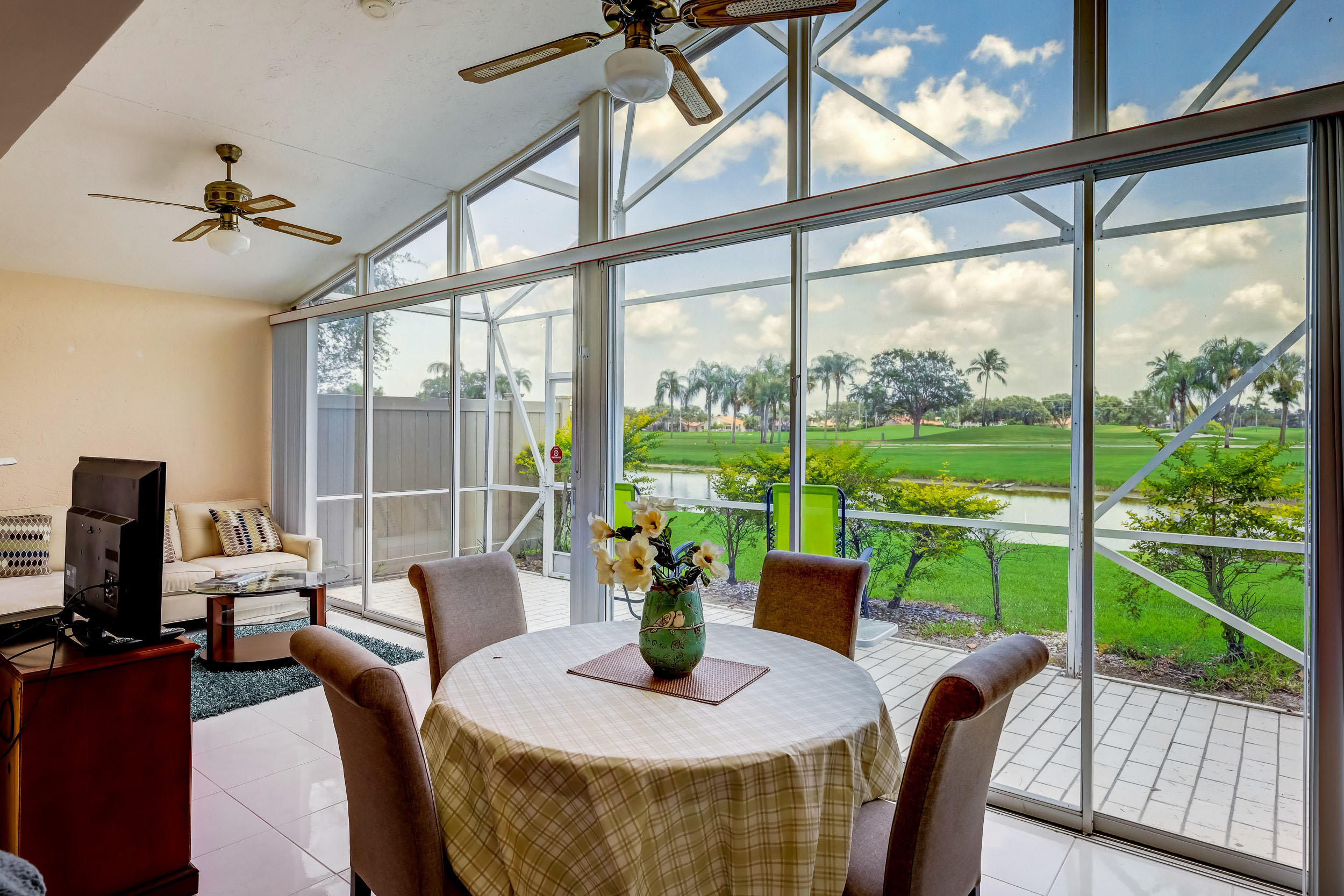 6741 Sun River Road Boynton Beach, FL 33437 - Photo 21 of 57 Glass enclosed patio w/spectular view