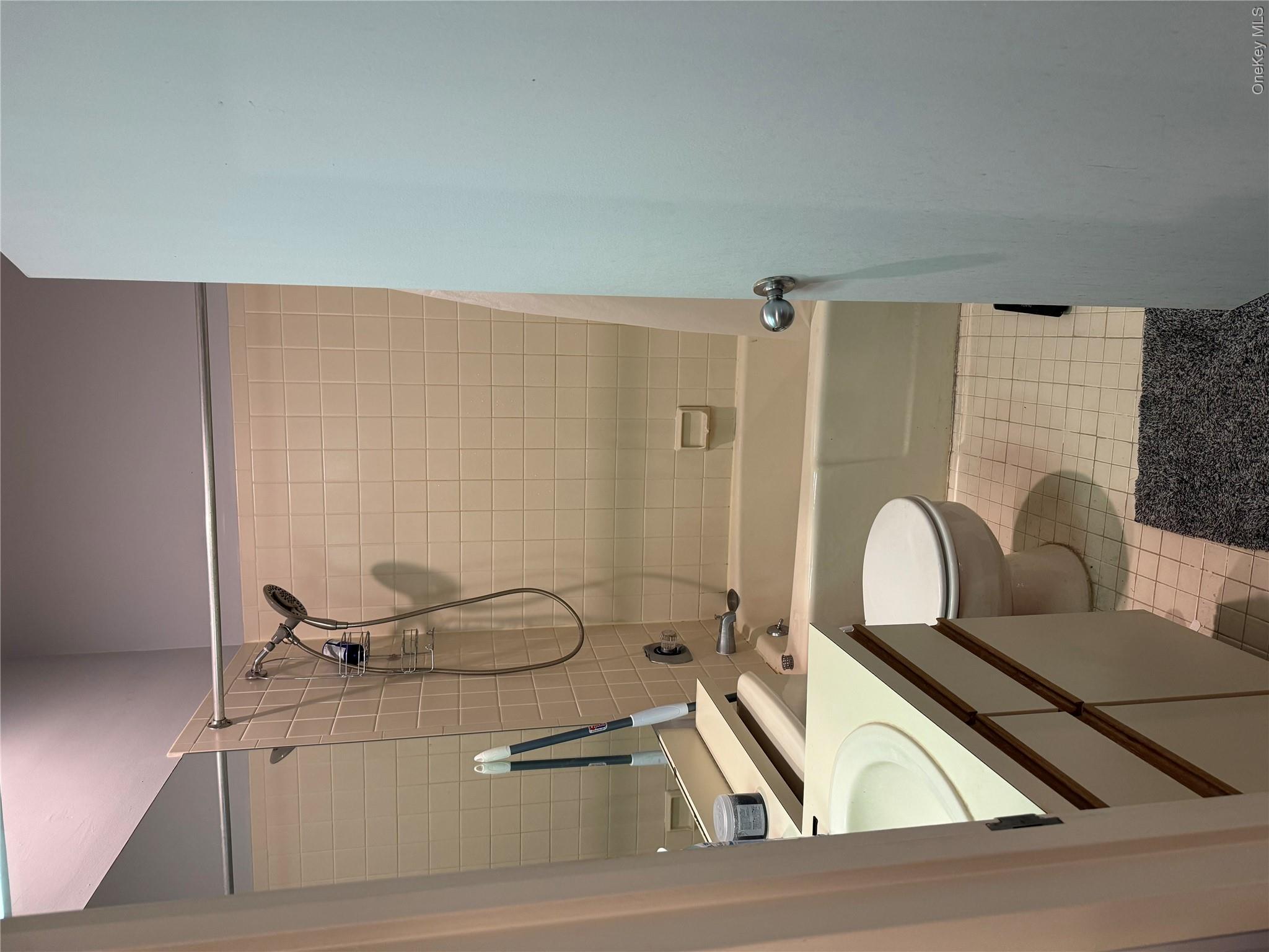 1701 Crompond Road, Unit 6313 Peekskill, NY 10566 - Photo 8 of 13 a bathroom with a granite countertop bathtub shower sink vanity and toilet